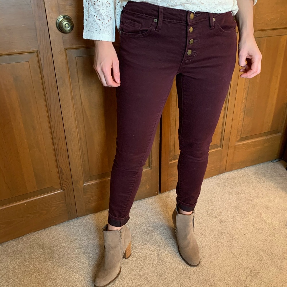 Plum colored low rise skinny jeans